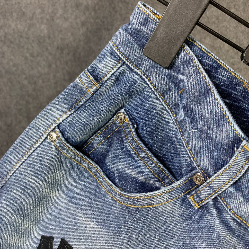 CHROME HEARTS Blue Jeans With Black Leather Crosses